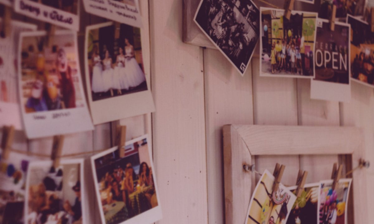 Memorial board pinned with dozens of photos.